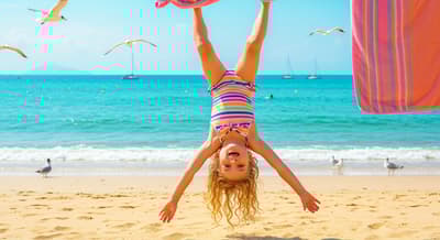 upside down cute little girl beach photography