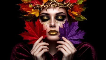 Ethereal Woman With Autumn Leaves Crown Photorealistic portrait of an ethereal woman, face partially obscured by colorful maple leaves. She wears a crown of autumn leaves and golden thorns. Her eyes are closed, adorned with dramatic dark eyeshadow and shimmering gold glitter. Her lips are painted a metallic gold. She holds a vibrant red maple leaf in her right hand and a purple maple leaf in her left, covering her cheeks. She is draped in dark, rich velvet fabric. Dark, moody lighting, high contrast, dramatic atmosphere. Black background. Intricate details, sharp focus.