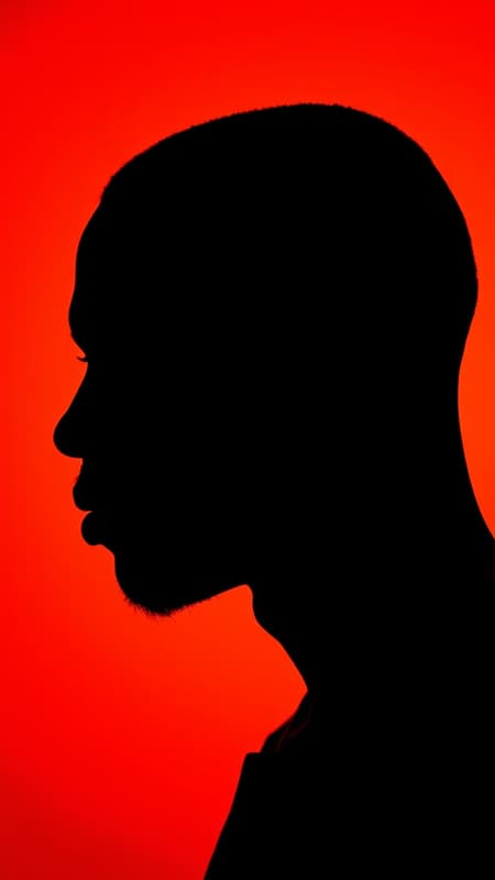 Photography, striking portrait of contrast, profile silhouette of a black man more sharply defined, set against a vivid orange background, capturing the essence using a camera setup that utilizes a large aperture, ensuring the focus is on the crisp silhouette edge, low ISO to preserve the deep color richness devoid of grain, photorealistic and UHD, aspect ratio 9:16, incorporating subtle artistic elements to enhance depth --chaos 1.7 --style raw Photography, striking portrait of contrast, profile silhouette of a black man more sharply defined, set against a vivid orange background, capturing the essence using a camera setup that utilizes a large aperture, ensuring the focus is on the crisp silhouette edge, low ISO to preserve the deep color richness devoid of grain, photorealistic and UHD, aspect ratio 9:16, incorporating subtle artistic elements to enhance depth --chaos 1.7 --style raw