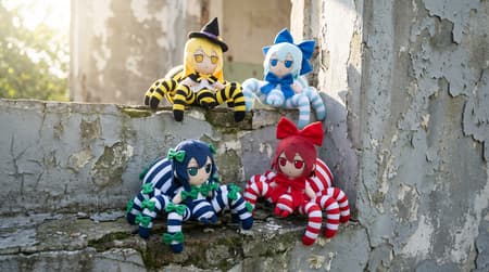Colorful Spider-bodied Anime Dolls On Concrete Four plush dolls, resembling anime girls with spider bodies, arranged on a cracked, peeling concrete wall. The top left doll is yellow and black striped with a witch's hat, the top right is light blue and white striped with a large blue bow, the bottom left is dark blue and white striped with green bows, and the bottom right is red and white striped with a large red bow. Photorealistic, soft natural lighting from the top left, creating subtle shadows. Bright, cheerful colors against a muted, aged background. The mood is whimsical and playful despite the worn setting.